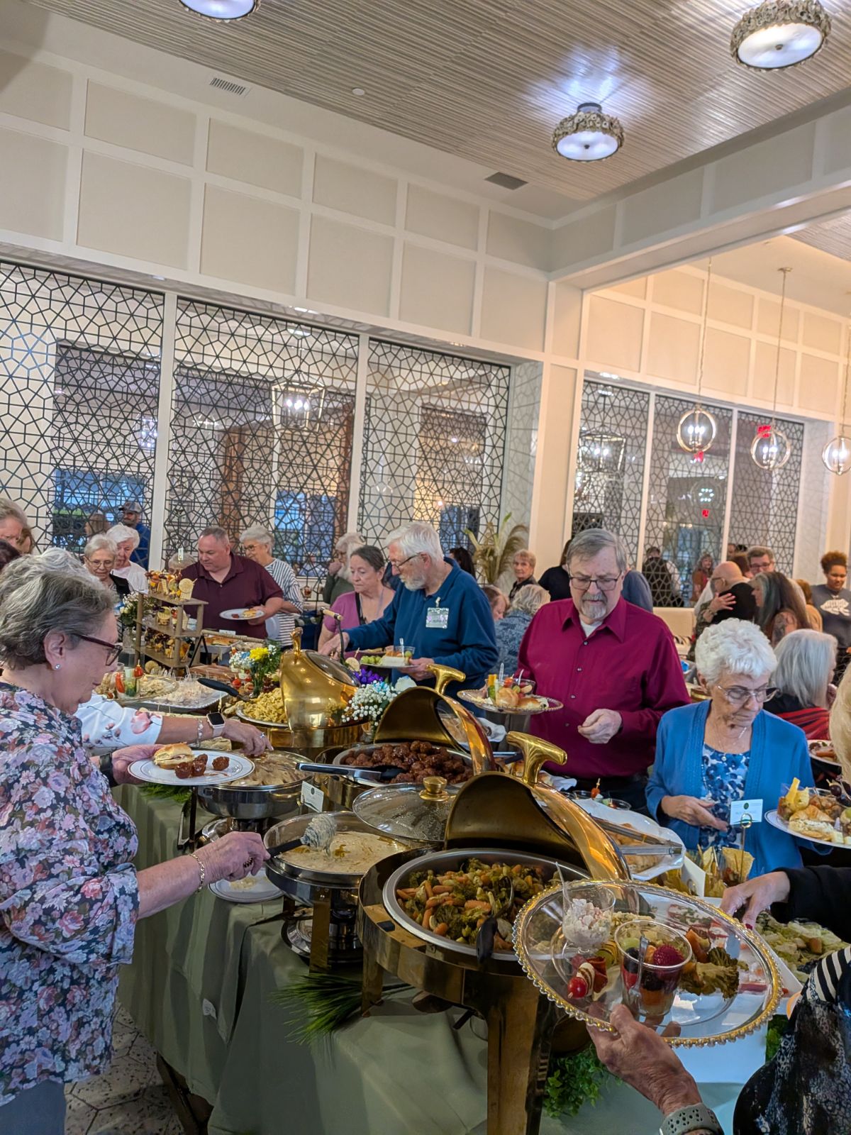 Guests enjoying a corporate buffet lunch catered by Castle Gardens ILM in Wilmington NC.